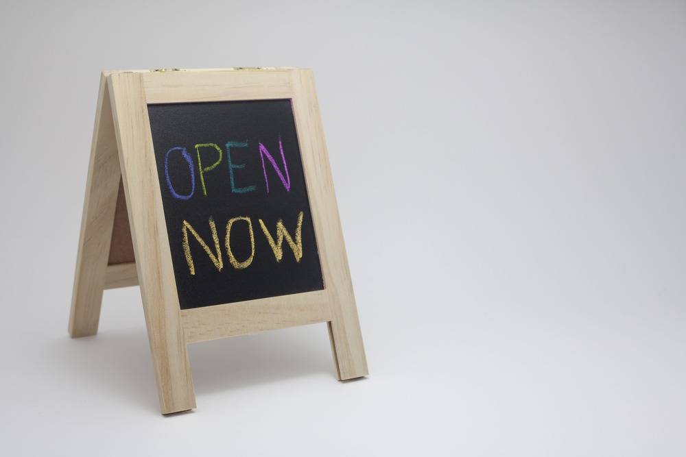 wording,'open,now',sign,concept,with,small,blackboard,on,white