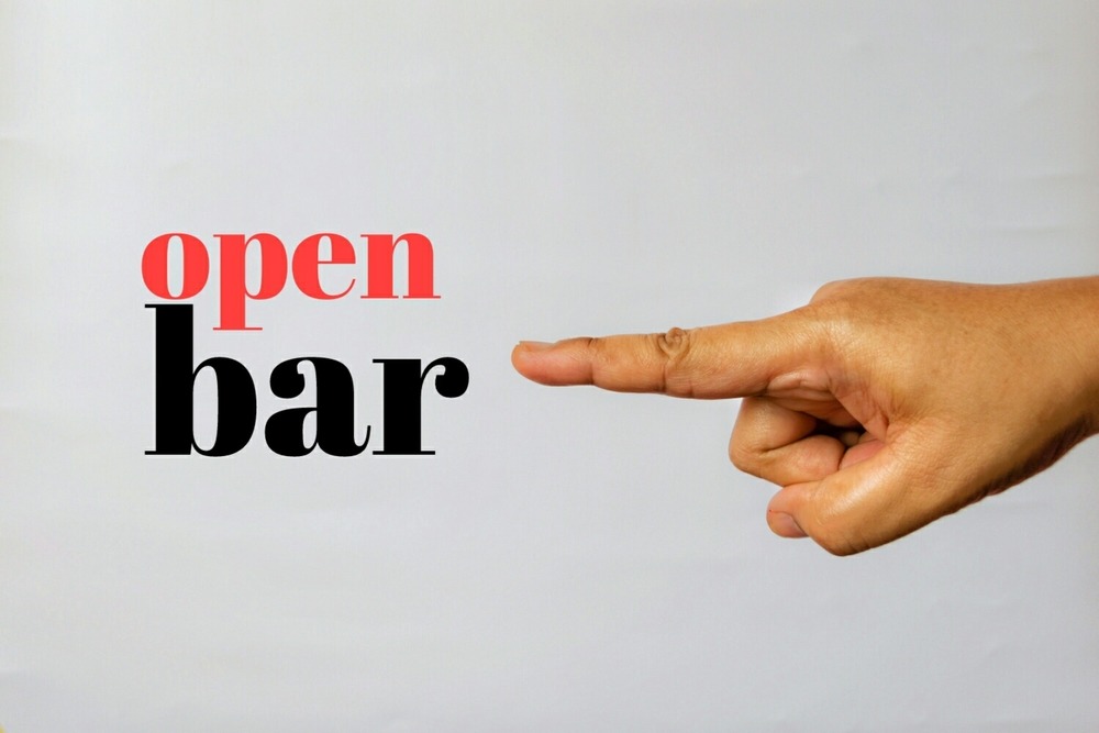 woman,hand,with,word,"open,bar",on,white,background,,