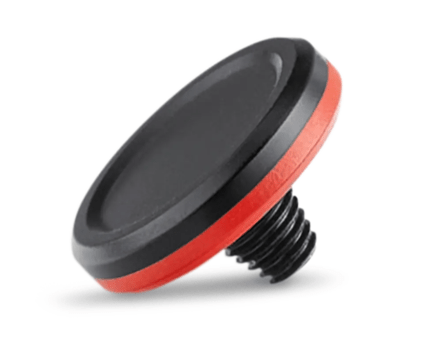 Bouchon magnétique noir et rouge, design incliné.